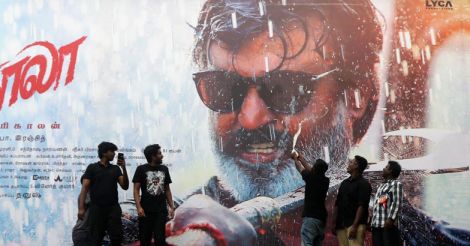 Chennai: Fans wash a poster of actor Rajinikanth with milk after release of his film \