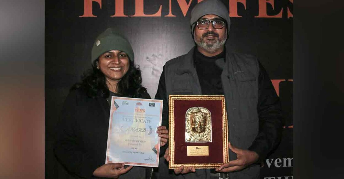 Producer and lead actor Dr Jeena Shaji and writer-director Sajesh Mohan pose with the citation and 'Best Short Film' award of the International Film Festival of Shimla on Sunday. 
