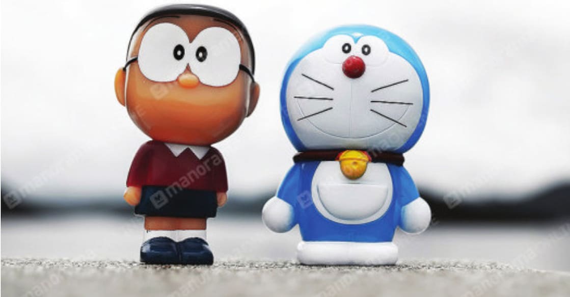 Replicas of popular cartoon characters Nobita (L) and Doremon