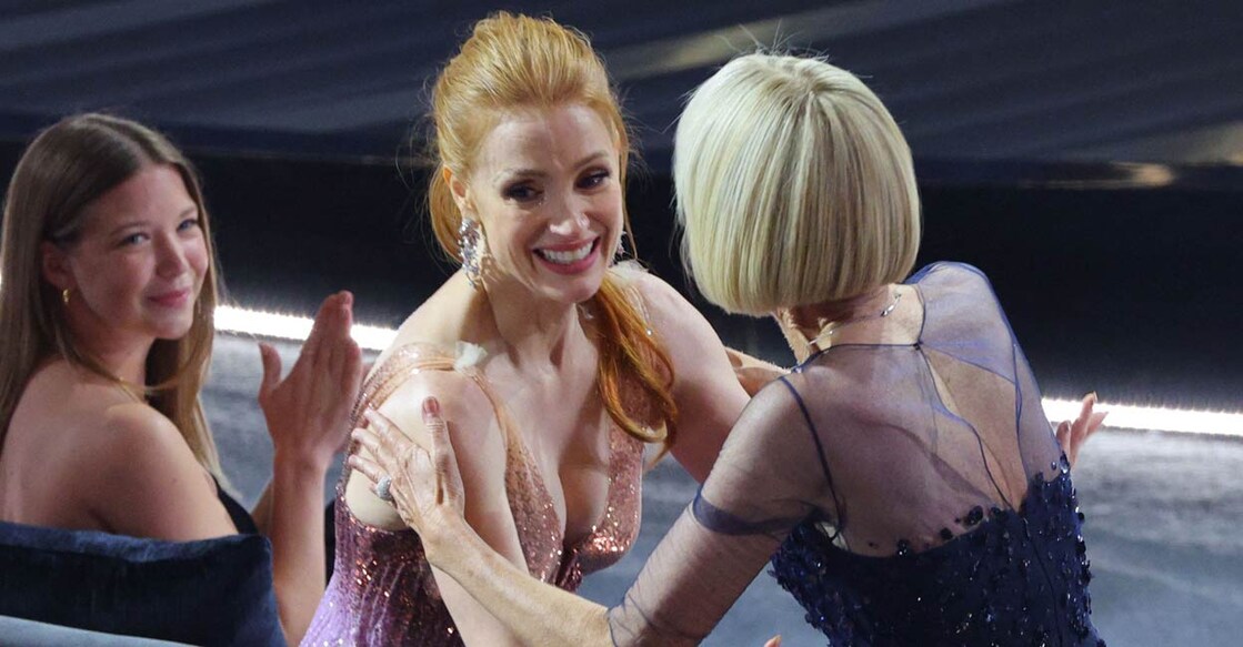 Jessica Chastain congratulates Linda Dowds Oscar for Best Makeup and Hairstyling for "The Eyes of Tammy Faye" at the 94th Academy Awards in Hollywood, Los Angeles, California, U.S., March 27, 2022. PHOTO: Reuters/Brian Snyder