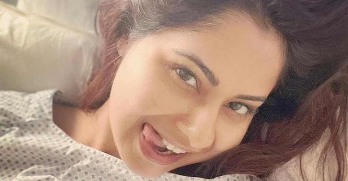 The selfie of actress Chhavi lying on the hospital bed and smiling. Photo: Instagram/IANS