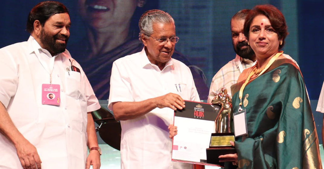 Revathi Revathi receives the Best Actor award from Kerala Chief Minister Pinarayi Vijayan in Thiruvananthapuram on Saturday. Photo: Facebook/ @chalachitraacademy