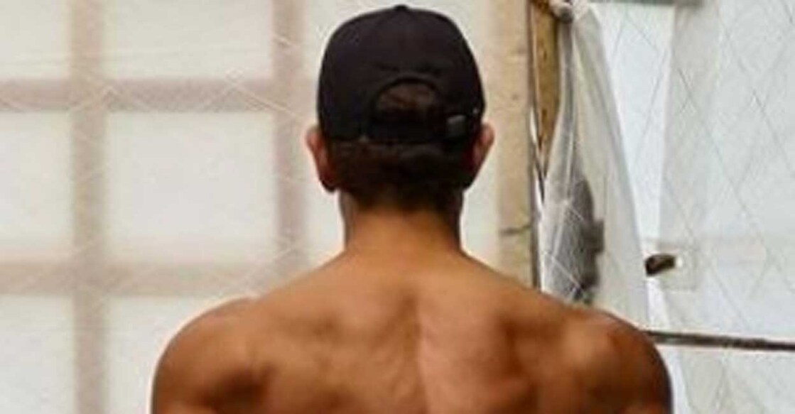 Hrithik Roshan In the image, his back is towards the camera and is wearing black pants and a cap. Photo: IANS