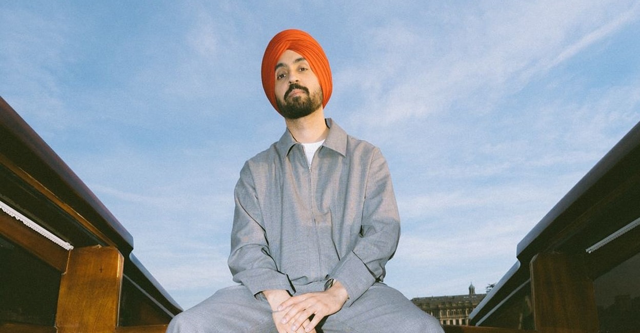 At a sold-out concert in Manchester, Diljit Dosanjh emotionally introduced his  mother and sister to the audience for the first time. Known for maintaining  privacy about his family, this heartfelt moment revealed, image size:1248x650