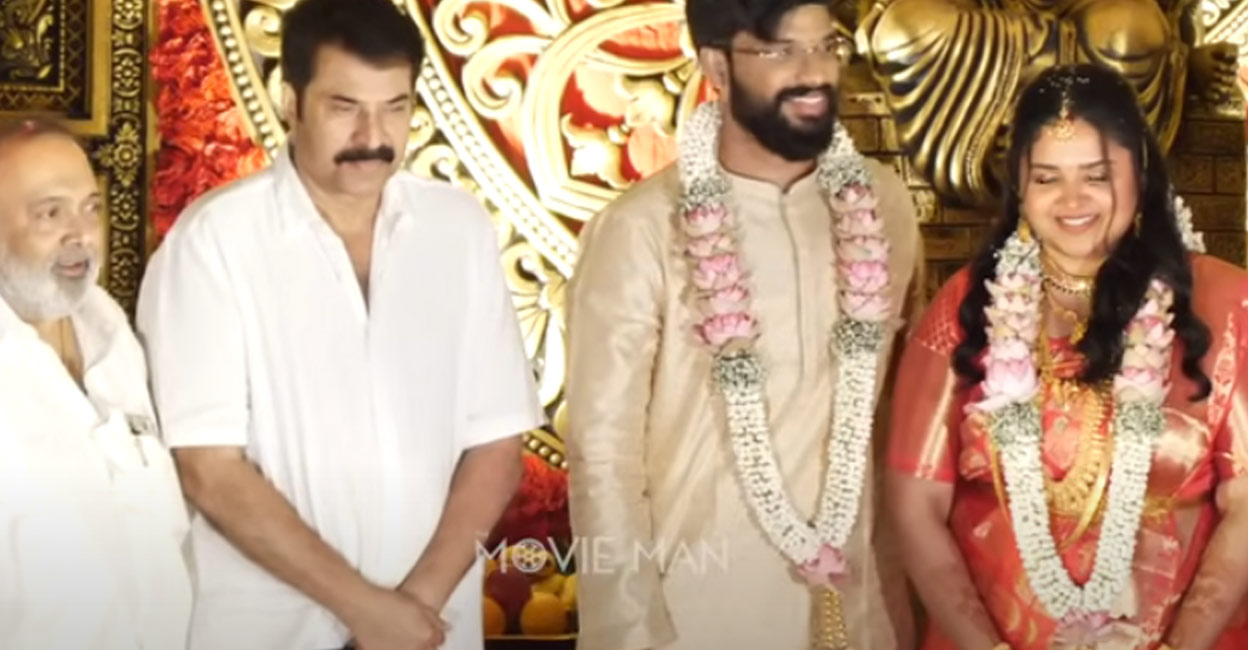 Mammootty with Ravi Kottarakara and the newly wed couple. Photo: YouTube/Movie Man
