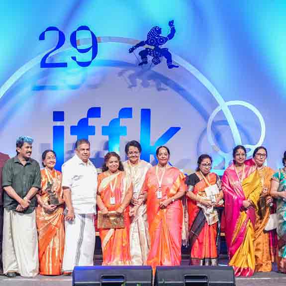 iffk-actress-minister Minister for Culture and Films Saji Cherian with veteran female actors from the Malayalam film industry at the 29th International Film Festival of Kerala. Photo: Special arrangement