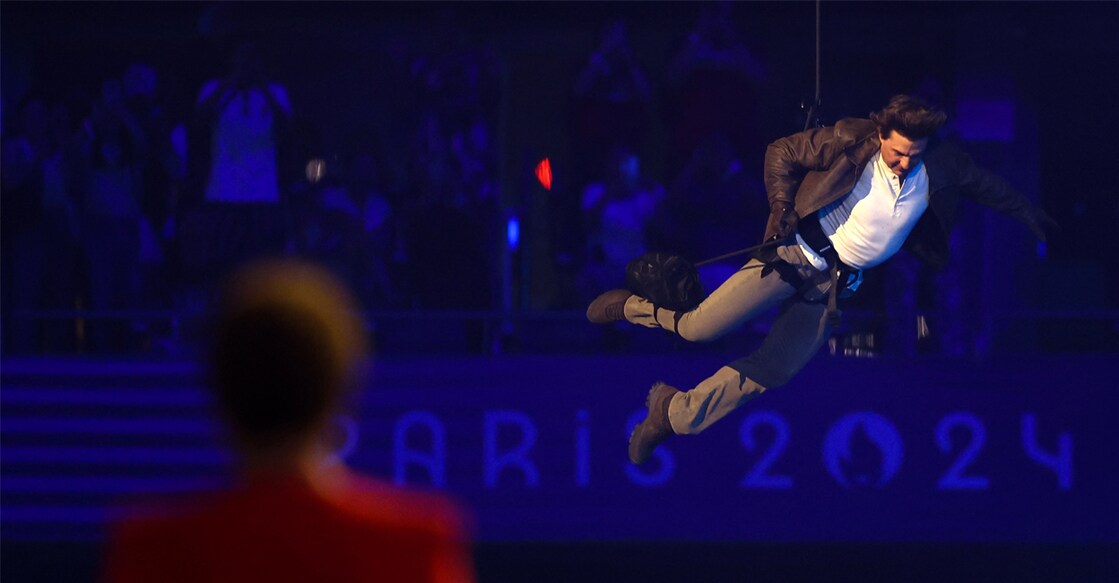 US' actor Tom Cruise lands from the roof in front one of the stadium entrances during the closing ceremony of the Paris 2024 Olympic Games. Photo: Franck Fife/ AFP