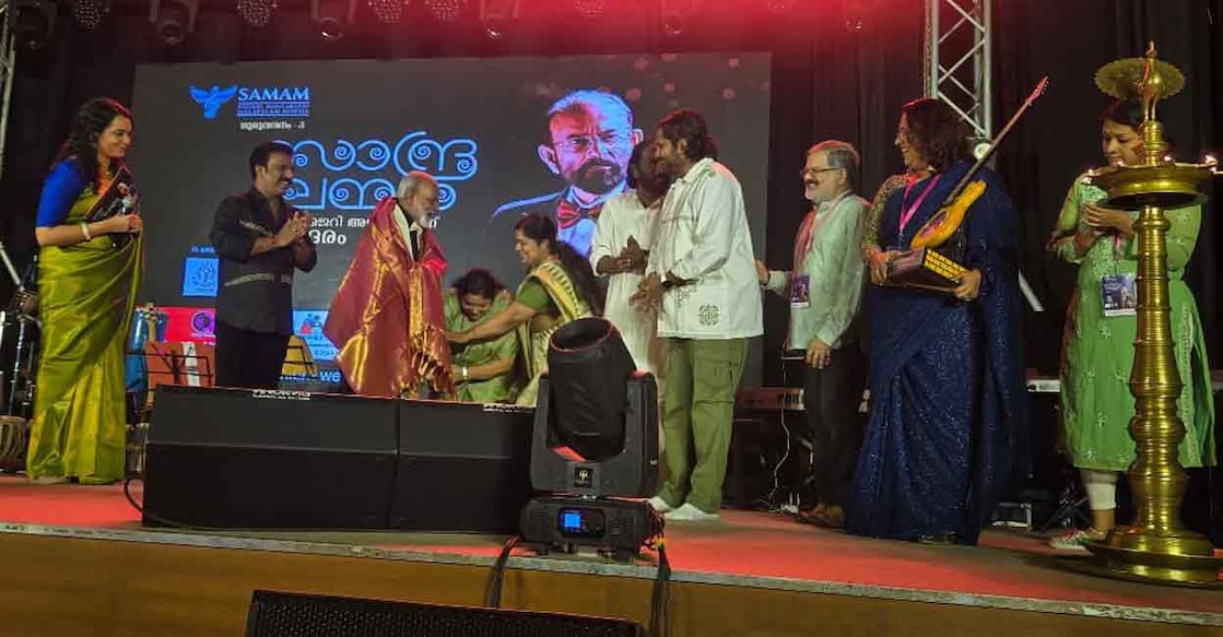 jerry-amaldev-ks-chithra-lathika Singers K S Chithra and Lathika honour Jerry Amaldev. Jyolsna, K G Markose, Sudeep Kumar, Krishnachandran, Ravi Shankar and Rajashree look on. Photo: Special arrangement