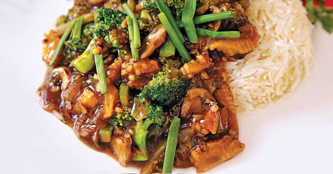 Stir fried mushroom and broccoli on rice