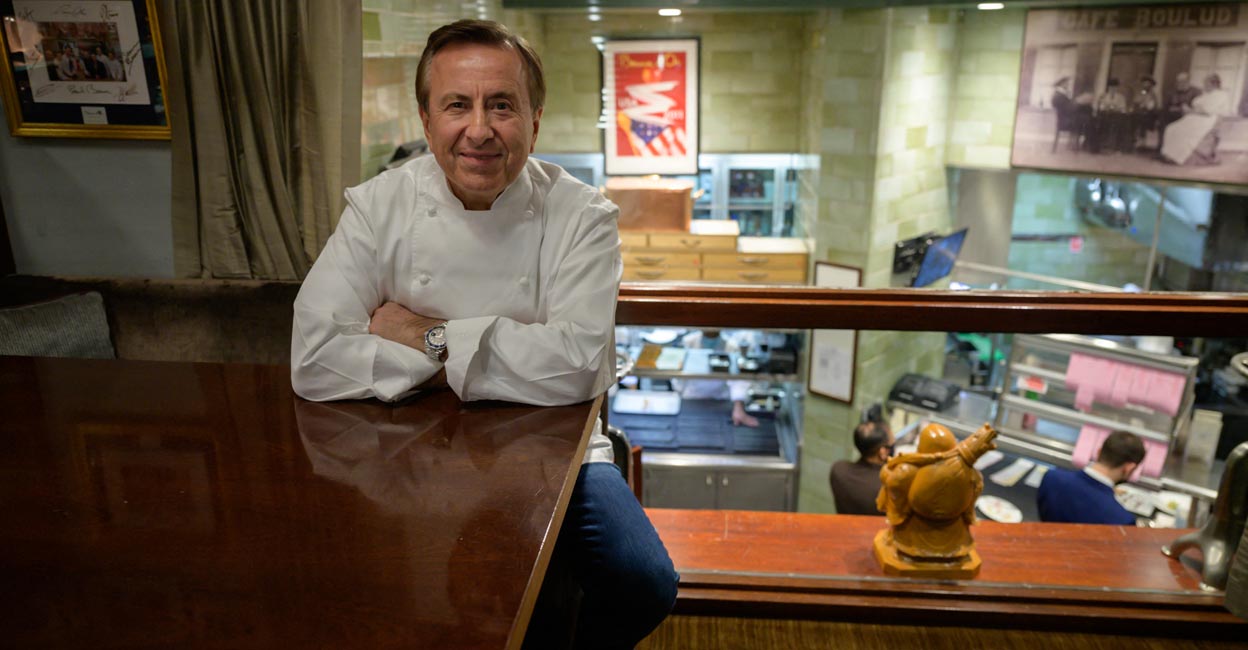French chef and restaurateur Daniel Boulud poses for a photo in the office of his restaurant 'Daniel', in Manhattan, New York | Photo: AFP