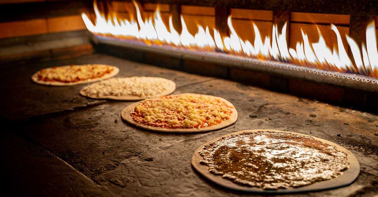 Lebanese food Manakish and pizza being baked in the oven . Photo: iStock/Shakeel Sha