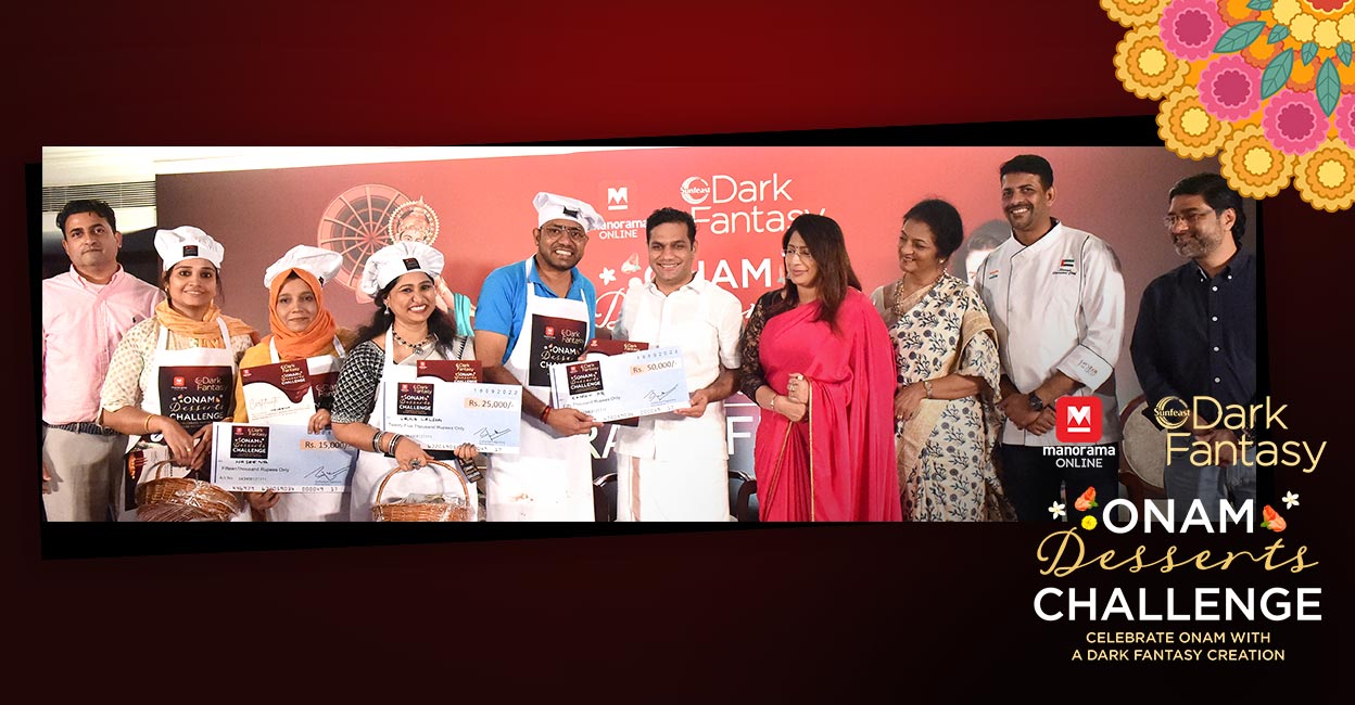 Rajeesh P R from Kottayam receiving the first prize of the Manorama Online Dark Fantasy Dessert Challenge contest held in Kochi, from Hibi Eden MP. Also seen are second prize winner Leena Lalson from Bengaluru; third prize winner Haseena from Kozhikode; Aneesha Mahroof, also from Kozhikode, who was selected for a special mention prize by the jury; Malayala Manorama Online Marketing Senior General Manager Bobby Paul; judges Dr Lakshmi Nair, Anita Isaac and Dhe Puttu corporate chef Sinoy John and ITC branch manager Bijith.