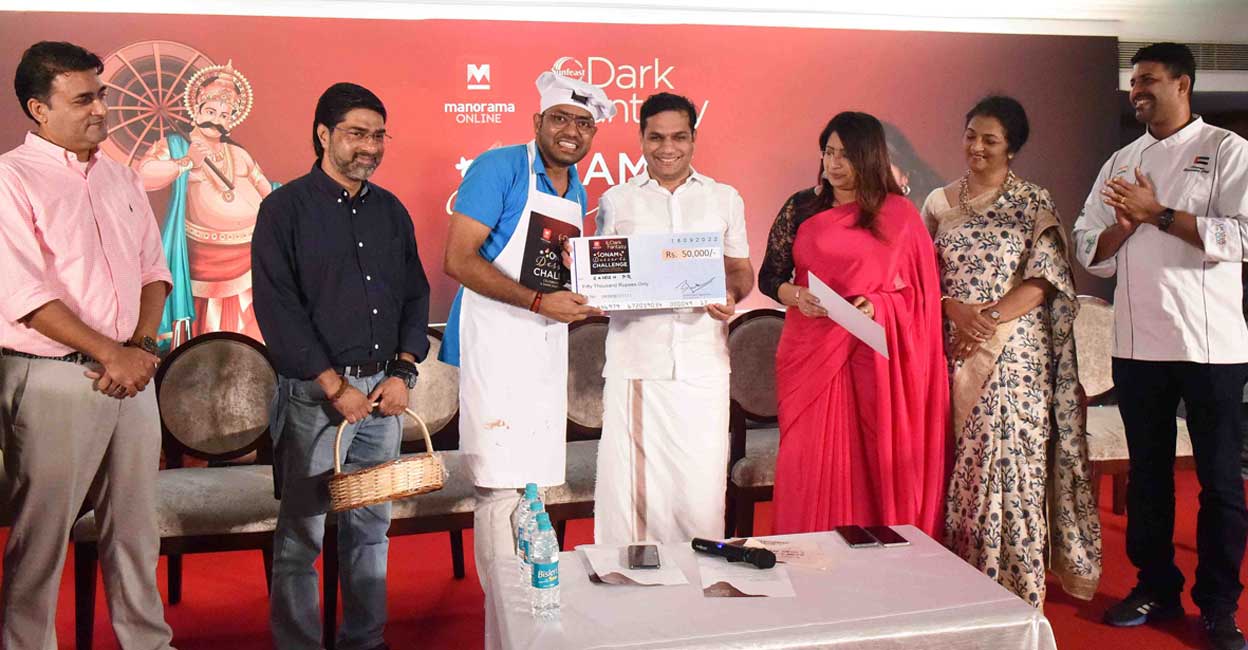 onam-dark-fantasy-contest-winners-2 Hibi Eden MP presenting the first prize to Rajeesh P R. Photo: Manorama/Robert Vinod