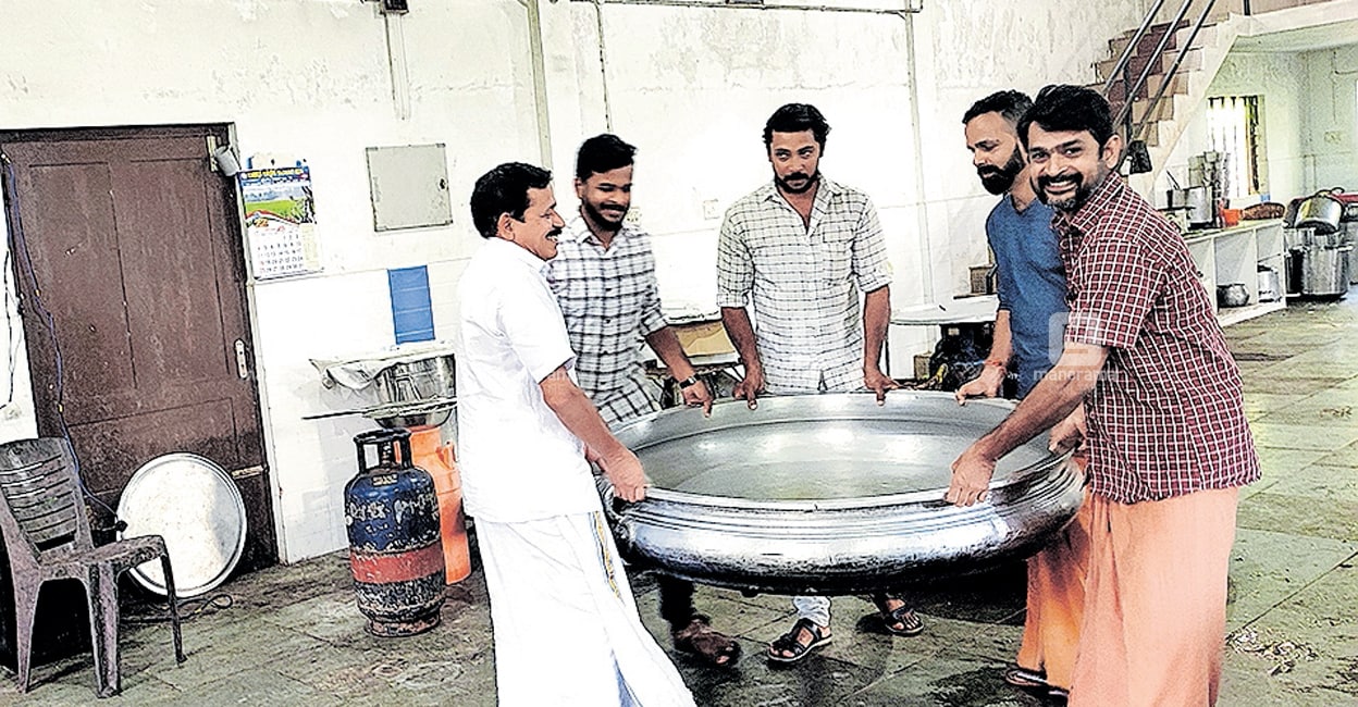pazhayidom-team Pazhayidom Mohanan Namboothiri and his team preparing their tools and vessels for the Kalolsavam feast. Photo: Manorama