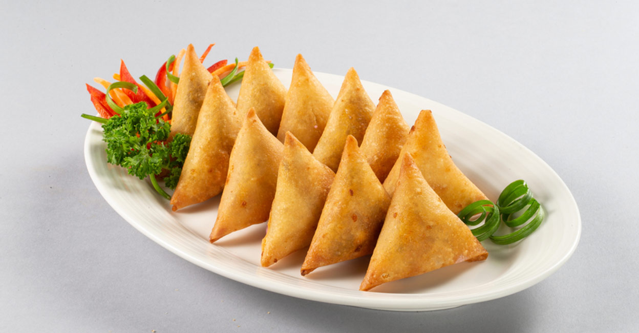 More than ninety vehicles, carrying samosas and other food items, travel to different locations from Samosapadi, every day. Photo: Shutterstock/Fahad Tariq