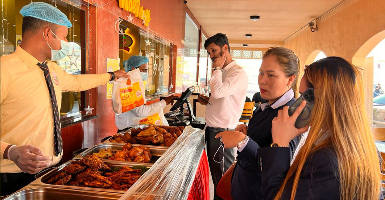 ifar-items Foreign customers at Al Madina Wide Range Restaurant in Dubai waiting to buy Kerala iftar snacks. Photo: Manorama