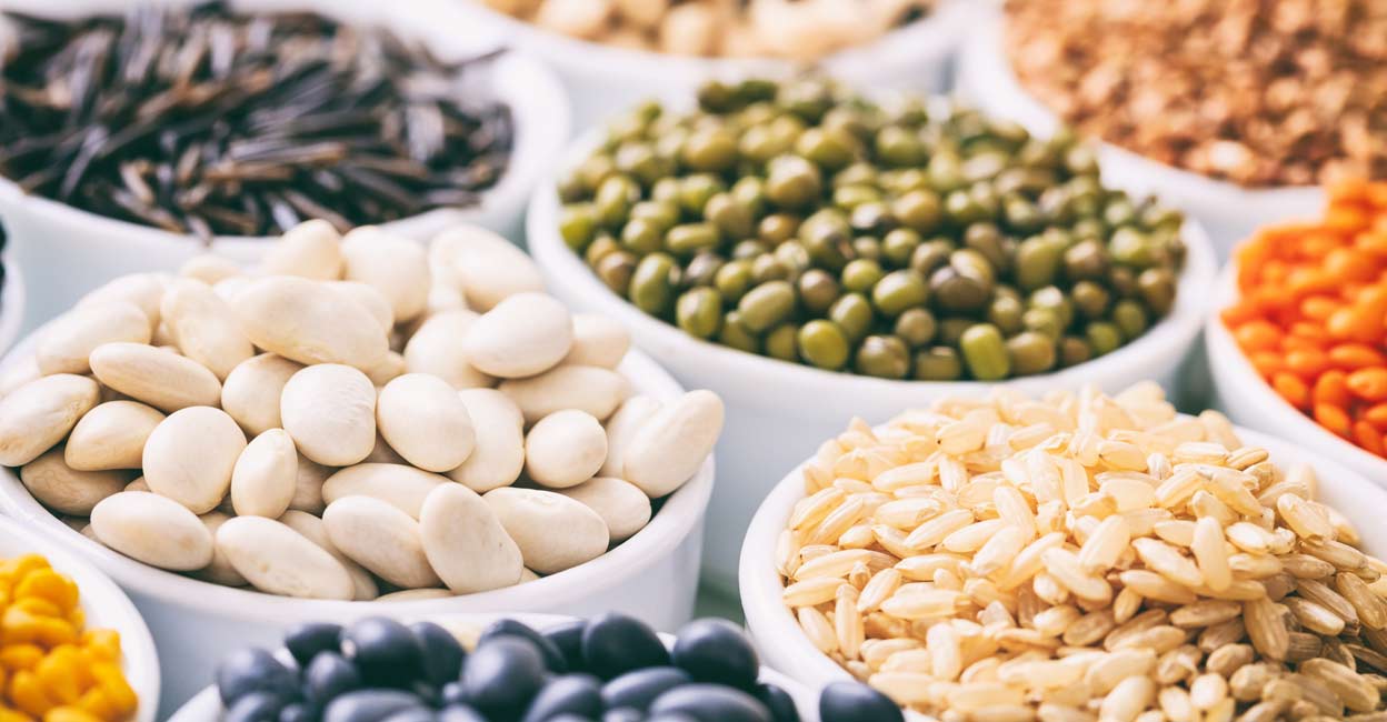 1025774150 Various raw legumes and rice in white bowls. Photo: iStock/Rawf8