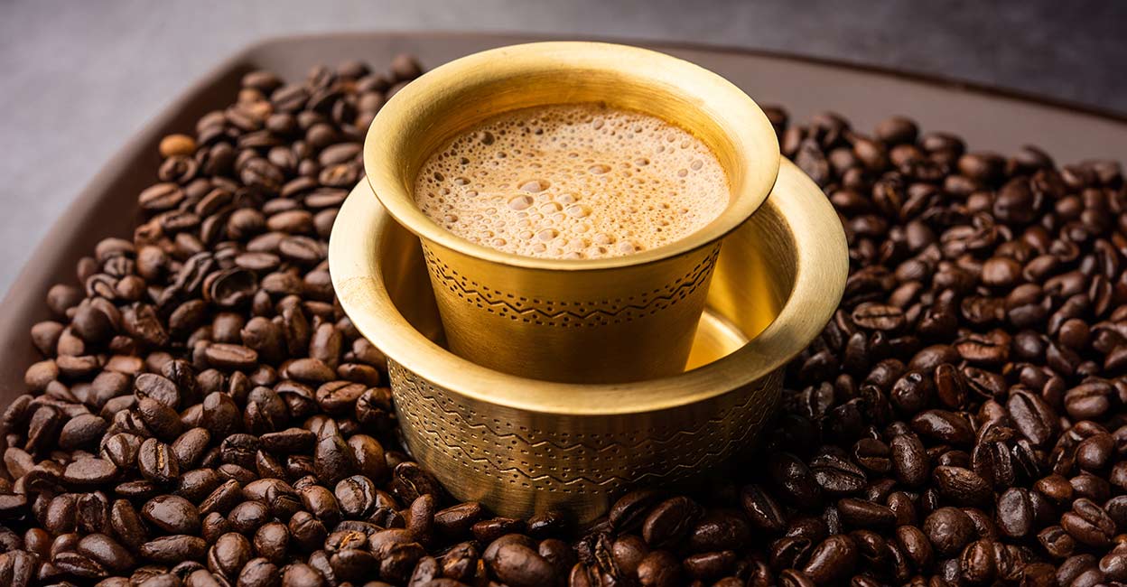 South Indian Filter coffee served in a traditional brass glass and davara set. Photo: iStock/subodhsathe