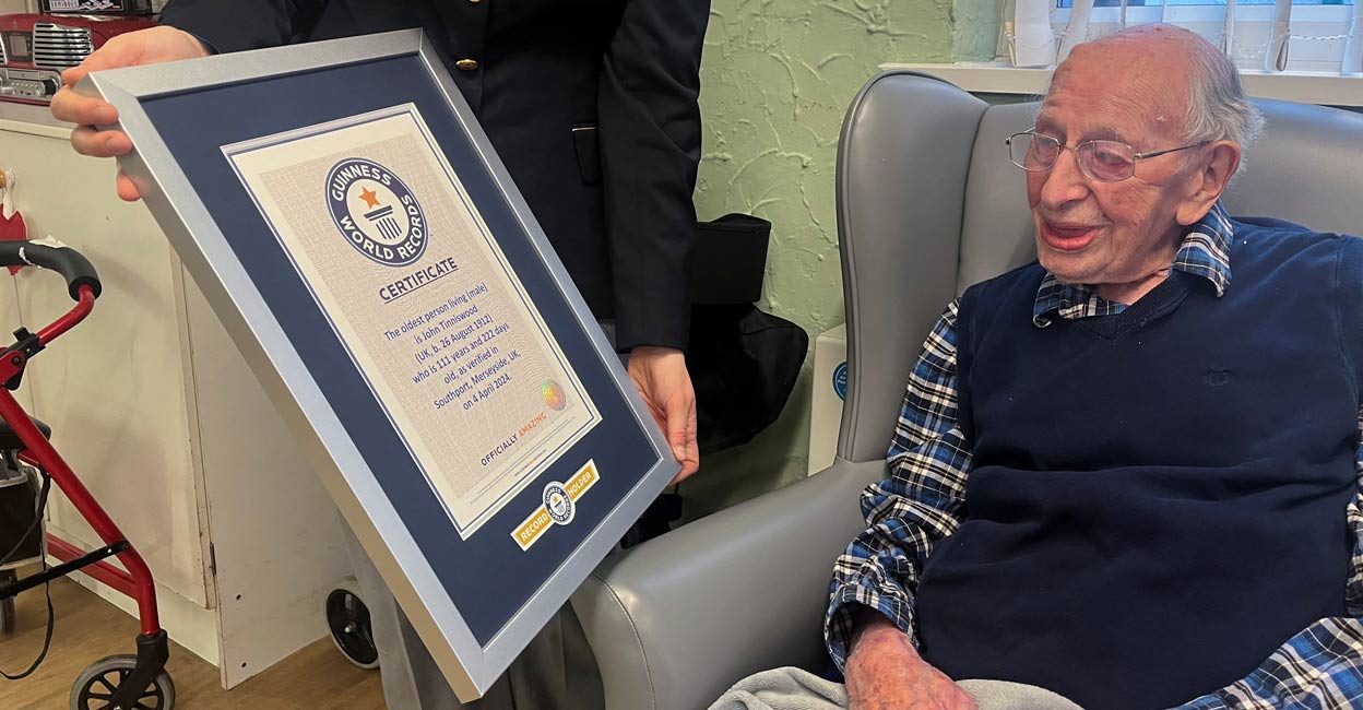 BRITAIN-OLDEST John Tinniswood, 111, poses with his certificate from the Guinness World Records, who announced that he is the world's oldest living man, in Southport, Britain April 4, 2024 in this handout image. Photo: Guinness World Records/Handout via REUTERS