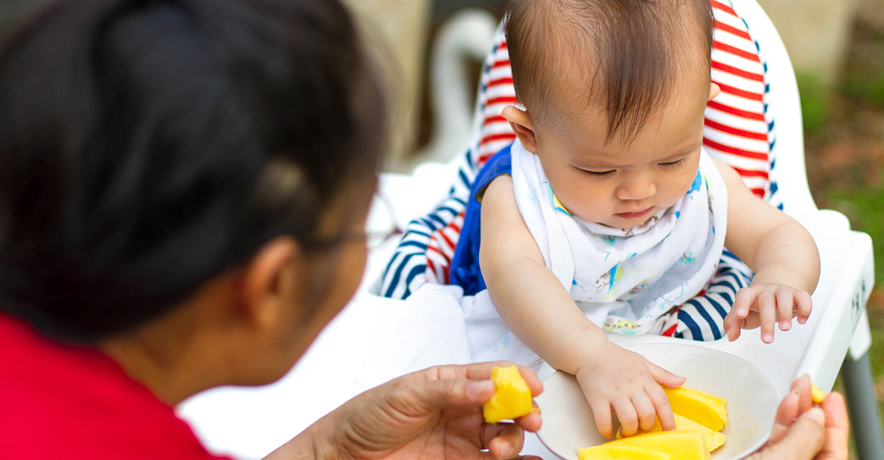 Baby eating mangoes Representative image: Shutterstock/bluedog studio