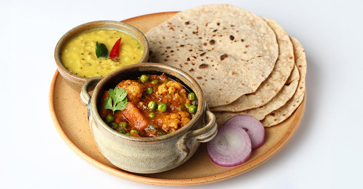 Chapati with dal and vegetable curries. Photo: Shutterstock/asmiphotoshop