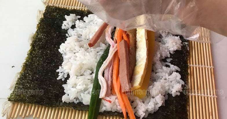 Kimbap stuffing on a seaweed spread Kimbap stuffing on a seaweed spread