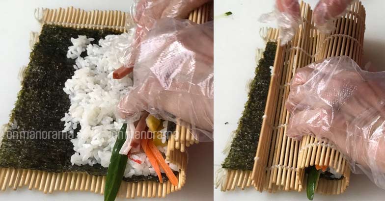 Rolling kimbap using a bamboo mat Rolling kimbap using a bamboo mat