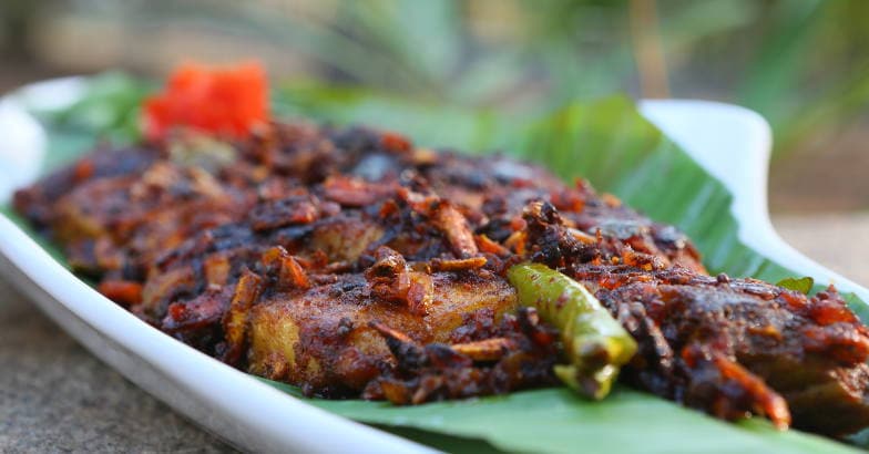 Meen pollichathu- Pomfret baked with spices and coconut milk