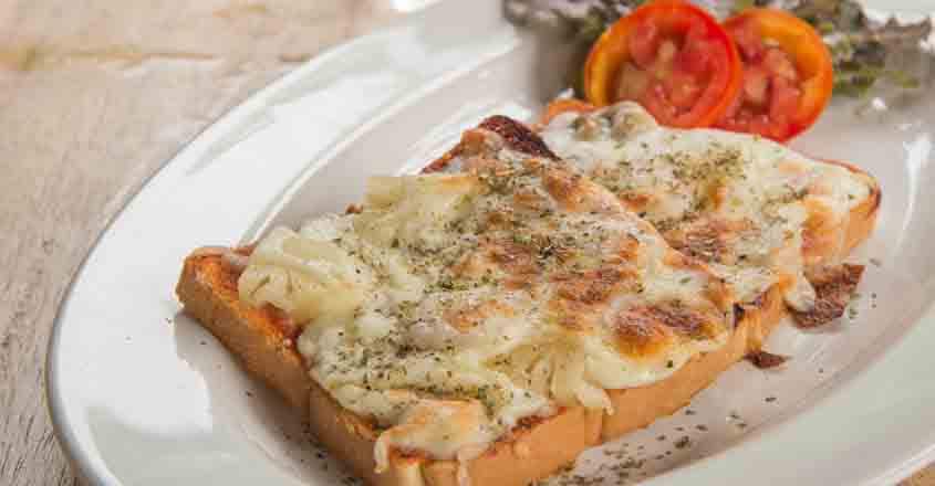 535442230 Pizza Toast,Glass of water placed on wooden table.