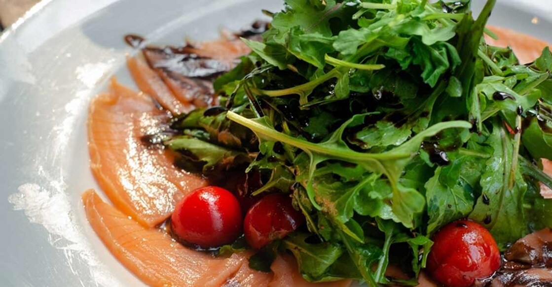 Salmon Carpaccio with rocket, cherry tomato and balsamic drizzle