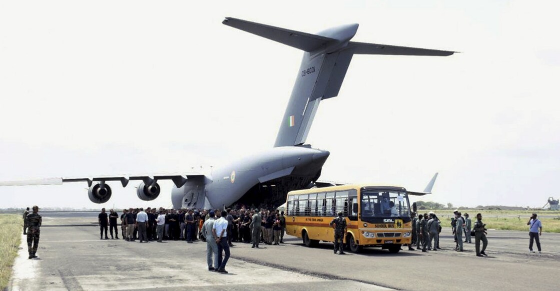 Indian nationals on their arrival from crisis-hit Afghanistan by an Indian Air Force's C-17 aircraft, in Jamnagar, Tuesday, August 17, 2021.