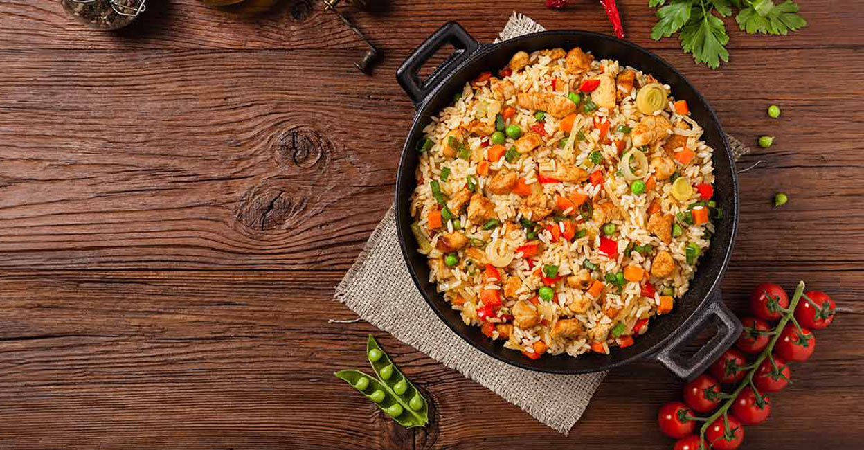 If you are ready to spend a little time in the kitchen, you can prepare a comparatively healthy chicken fried rice at home. Photo: Shutterstock/gkrphoto