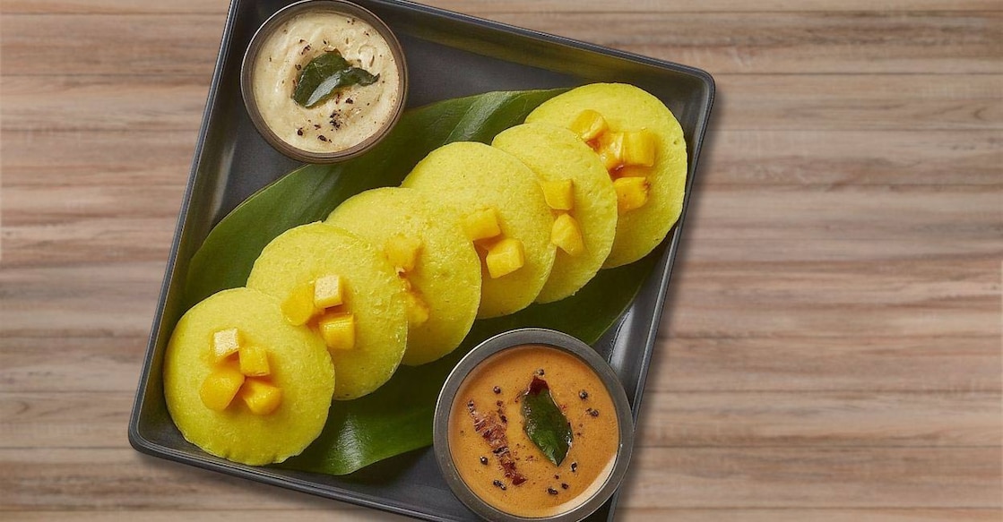 Mango idli is a delightful variation of the traditional South Indian idli, incorporating the sweet and tangy flavours of mango. Photo: Created using Imagen