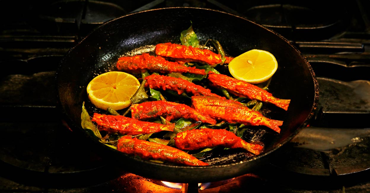 Frying marinated sardine Frying marinated sardine. Photo: iStock/libin jose