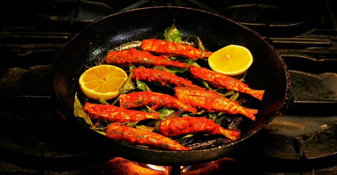 Frying marinated sardine. Photo: iStock/libin jose 