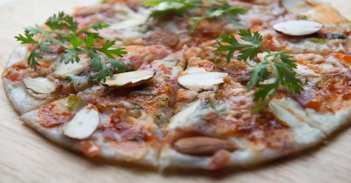 Toasted almonds and tomato uthappam pizza