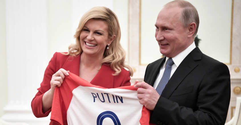 Croatian prez hands Putin soccer jersey before World Cup final