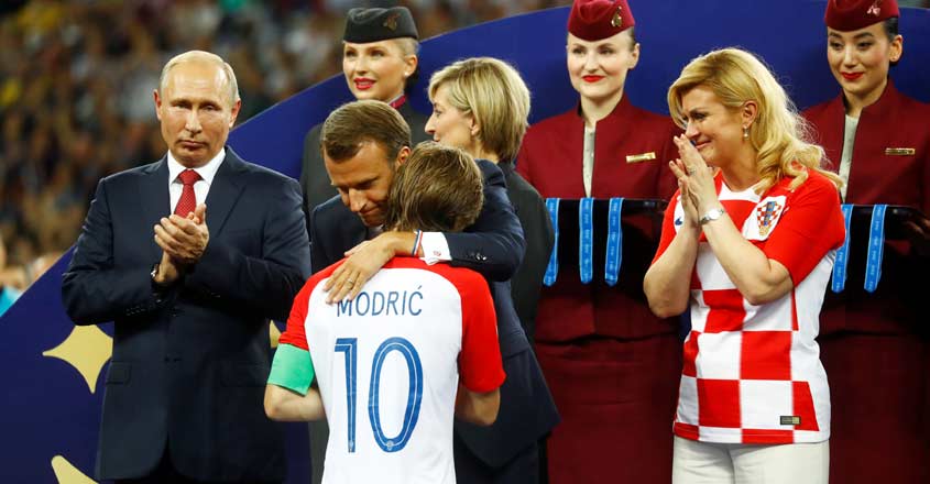 Croatian prez flies economy class to world cup, does a jig and hug too