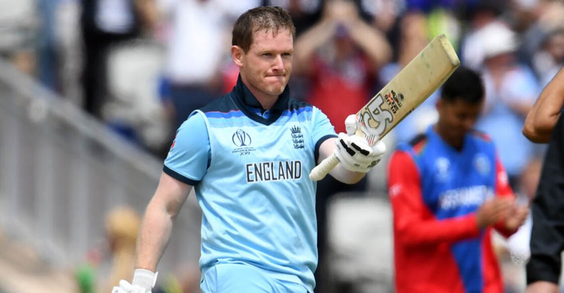 England's captain Eoin Morgan celebrates his century during the 2019 Cricket World Cup group stage match between England and Afghanistan at Old Trafford in Manchester, northwest England, on June 18, 2019. (Photo by Dibyangshu SARKAR / AFP) / RESTRICTED TO EDITORIAL USE