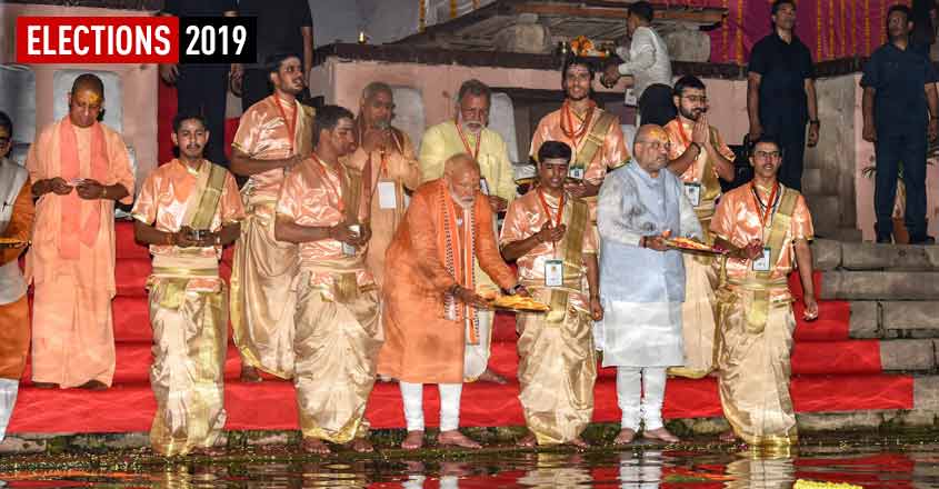 PM Modi holds mega roadshow in Varanasi, performs Ganga aarti
