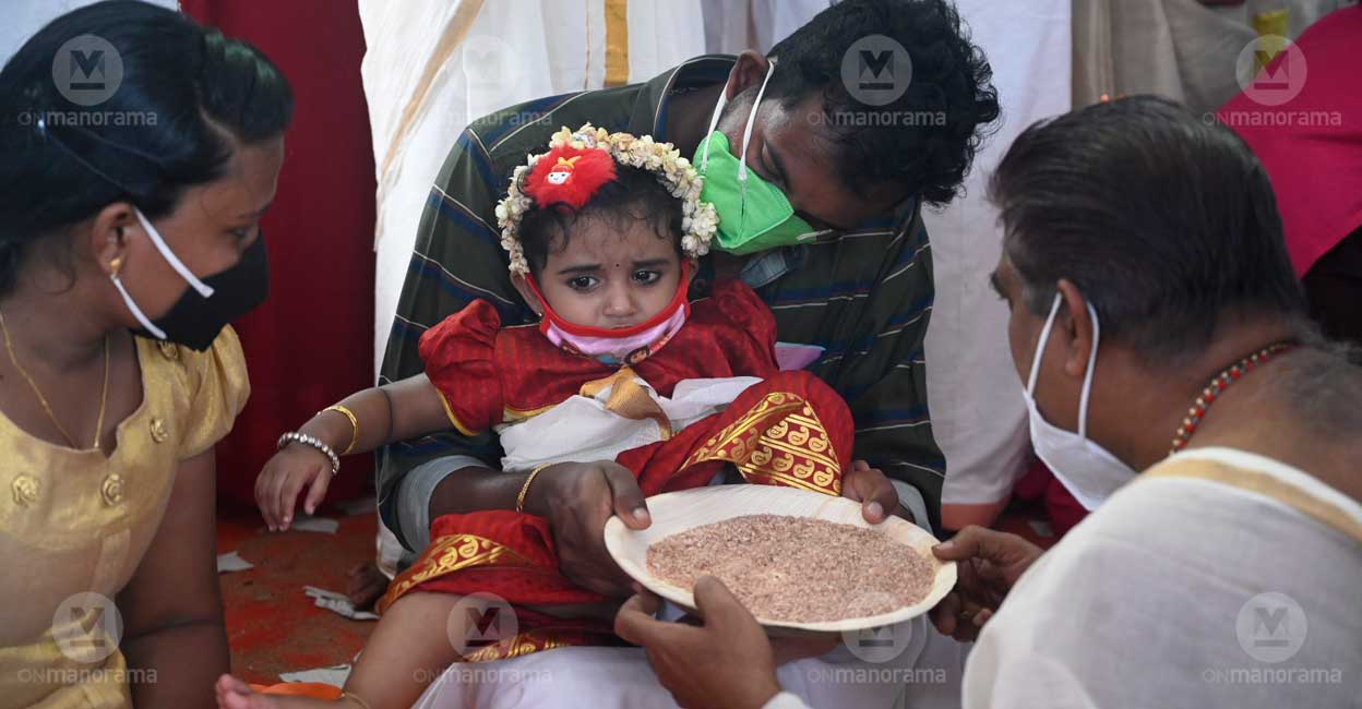 Setting aside COVID concerns, children step into world of knowledge in Kerala As per customs, scholars, writers, teachers, priests and other prominent figures in society make children write their first letters of learning on the occasion at temples and cultural centres across the state. Photo: E V Sreekumar