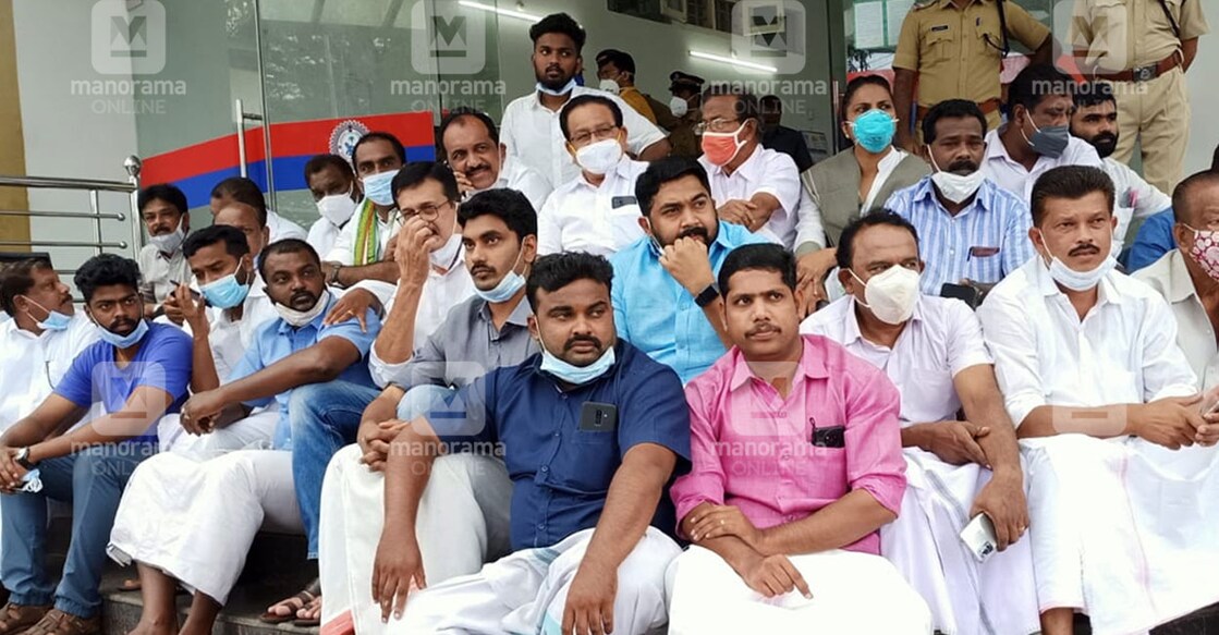 Anwar Sadath, MLA, Benny Behennan, MP, Mohammed Shiyas, DCC president, and M O John, Municipal chairman, stage a sit-in protest on Wednesday. 