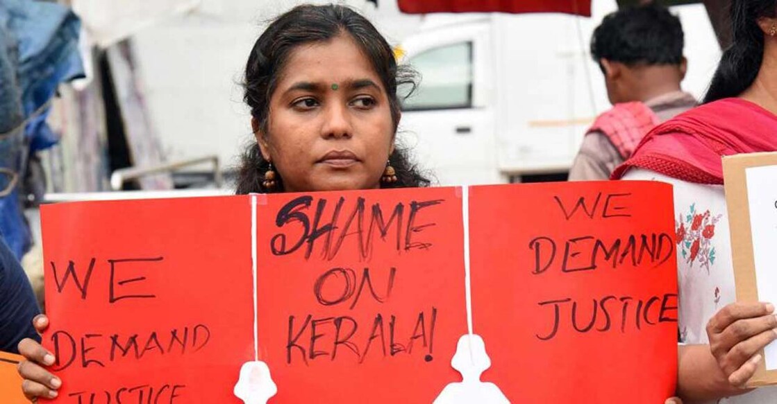 An activist participates in a protest meet organised in Kochi seeking justice for the minor girls in Walayar. File/PTI