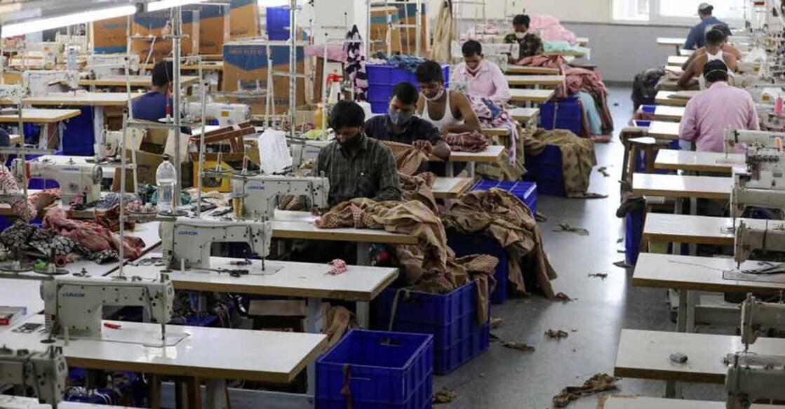 Workers stitch garments at a factory of an apparel shop in the city of Jaipur. REUTERS/Anushree Fadnavis/File Photo