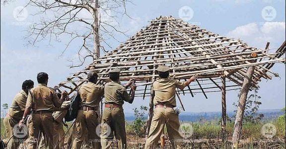 Police dismantle huts made by Adivasis Police dismantle huts made by Adivasis