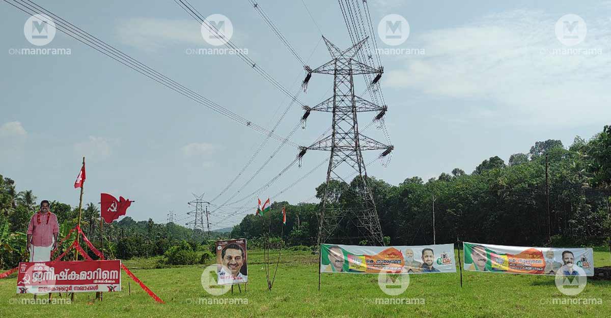 Flex boards and banners of Konni's three main contenders erected across a fallow paddy field in Konni Flex boards and banners of Konni's three main contenders erected across a fallow paddy field in Konni