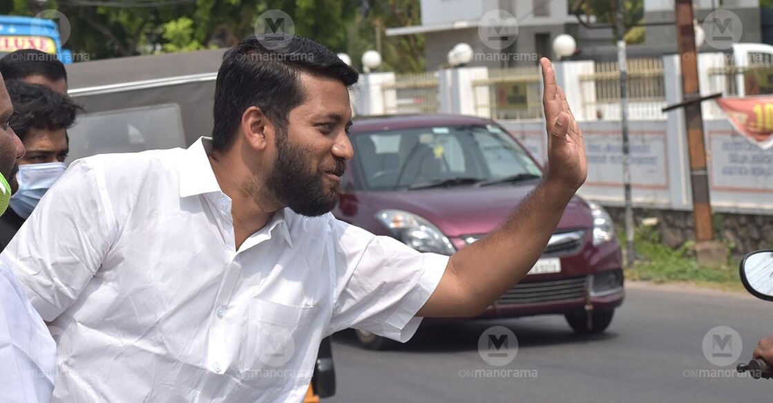 UDF candidate in Palakkad Shafi Parambil waves to motorists on Sunday. Photo: TA Ameerudheen