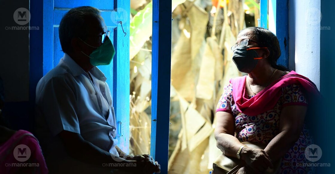 An elderly man and woman wait for their turn to get vaccinated against coronavirus at a vaccination centre in Kottayam. Photo: Gibi Sam