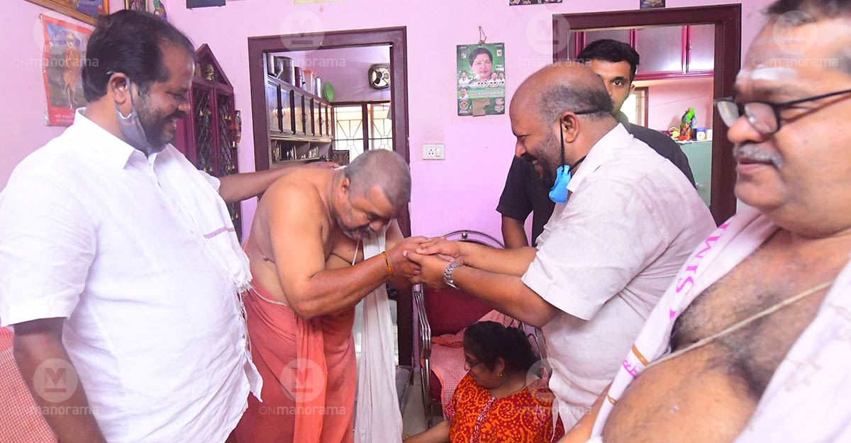 A voter greets Agriculture Minister V S Sunil Kumar even as LDF candidate P Balachandran (left) looks on Russell Shahul A voter greets Agriculture Minister V S Sunil Kumar even as LDF candidate P Balachandran (left) looks on Russell Shahul