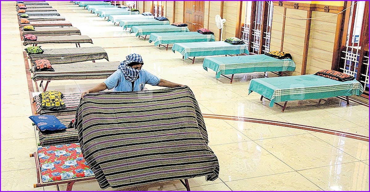 Hospitals in Ernakulam run short of ICU beds as COVID grips more A staff preparing beds for COVID patients at a First-Line Treatment Centre in Anugraha Auditorium in Kaloor, Kochi.